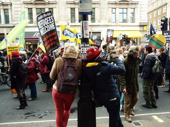 People with banners protesting on city street