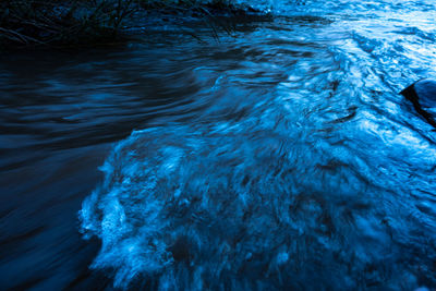 High angle view of water flowing in sea