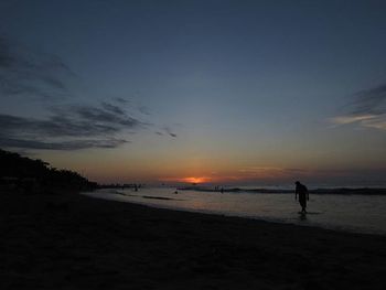 Scenic view of sea at sunset