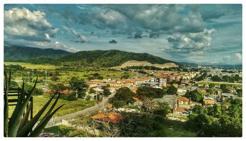 High angle view of town against cloudy sky