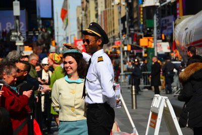 People standing on street in city