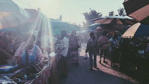 People at market stall