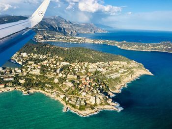 Aerial view of sea and bay against sky