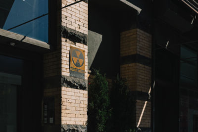 Low angle view of illuminated sign on building