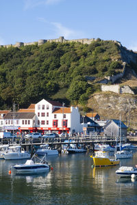 Looking across scarborough harbour with the castle walls above and behind