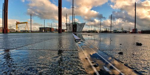 Reflection of cityscape in puddle