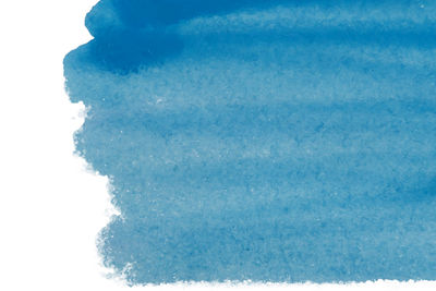 Close-up of bubbles over sea against white background