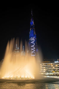 Illuminated buildings in city at night