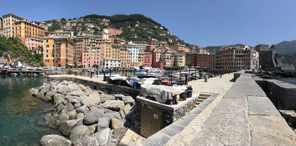 Panoramic view of river and buildings against clear sky