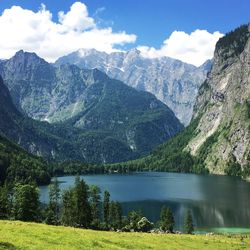 Scenic view of lake and mountains against sky