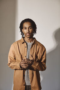 Portrait of young man over white background