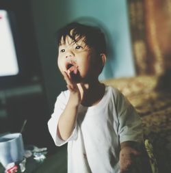 Close-up of boy eating chocolate