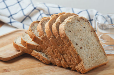 Sliced whole wheat bread on the wooden board