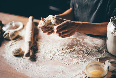 Midsection of man preparing food