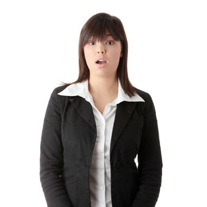 Portrait of young woman against white background