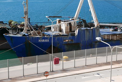 High angle view of sailboats moored at harbor