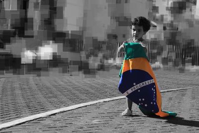 Full length of woman looking away in city