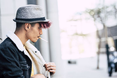 Portrait of young man looking away