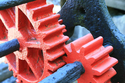 Close up of red cogs
