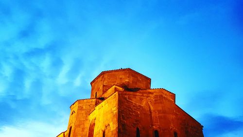 Low angle view of built structure against blue sky