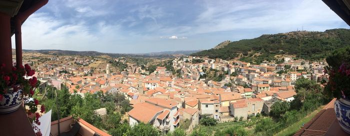 High angle view of houses in town against sky