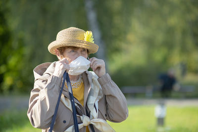 Portrait of senior woman wearing  face mask  - lifestyle of elderly retired people  holiday