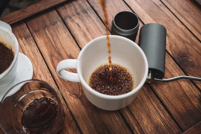 Barista dripping coffee and slow coffee bar style