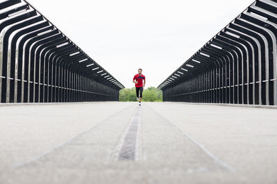 Man running on a bridge