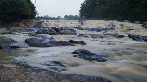 Scenic view of water flowing through rocks