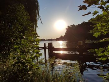 Scenic view of lake against sky during sunset