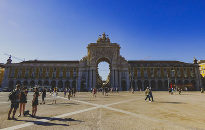 Group of people in front of historical building