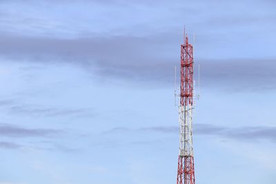 Low angle view of communications tower against sky