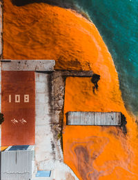 Aerial view of dirty water by factory