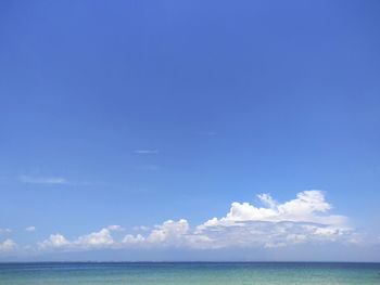 Scenic view of sea against blue sky