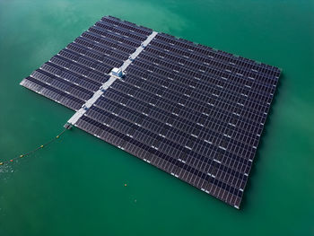 Aerial view of a solar park with solar panels in the water