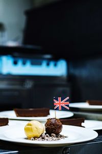 Dessert with british flag in plate on table