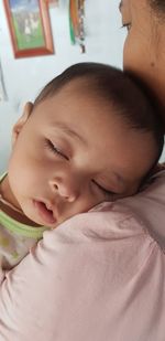 Close-up portrait of cute boy at home