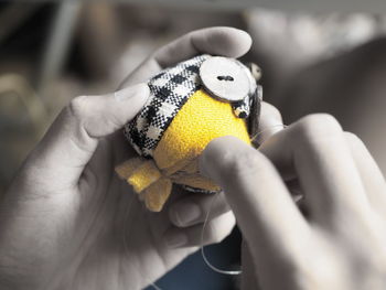 Close-up of hand holding toy