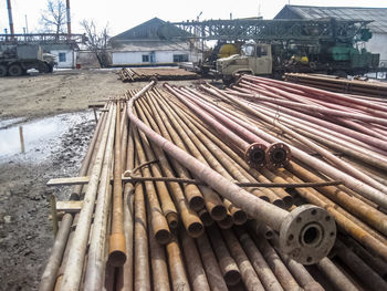 High angle view of pipes on field against sky