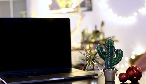 Close-up of christmas decorations on table at home