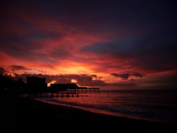 Scenic view of dramatic sky over sea during sunset