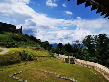 Scenic view of landscape against cloudy sky