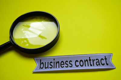 Close-up of information sign on table