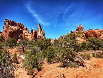 Rock formations on landscape against sky