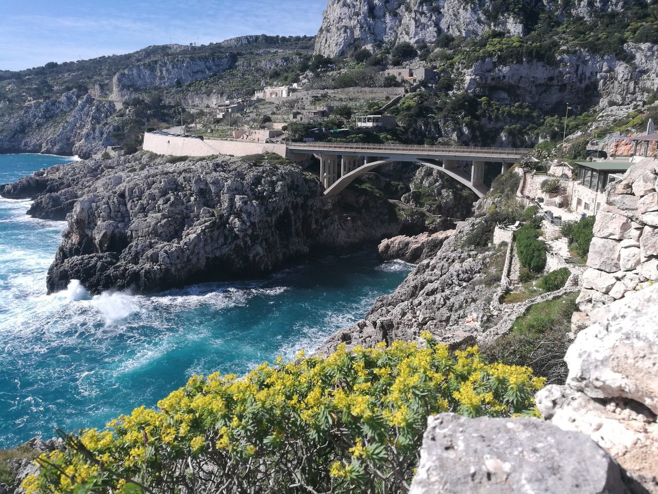 bridge - man made structure, connection, nature, river, water, mountain, architecture, rock - object, bridge, outdoors, day, beauty in nature, no people, landscape, built structure, scenics, sky