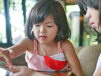 Close-up of young woman looking away