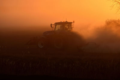 Scenic view of field against sky during sunset