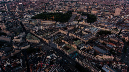 High angle view of buildings in city during sunset