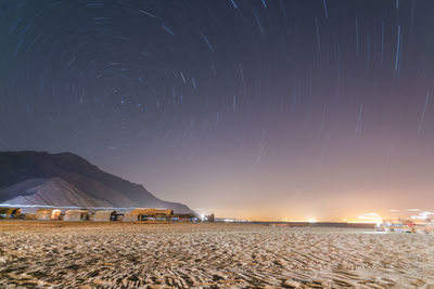 Long exposure star trail in sinai with bungalows