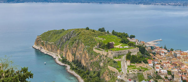 High angle view of sea and buildings against sky